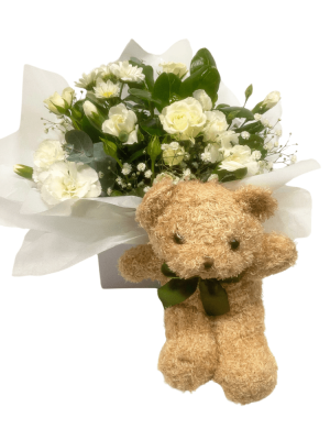 Seasonal white flower box with Teddy bear