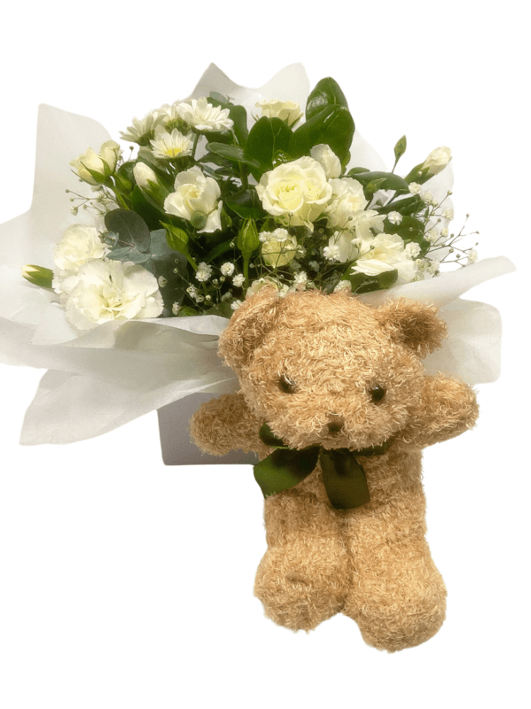 Seasonal white flower box with Teddy bear
