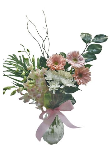 orchids and gerberas in glass vase