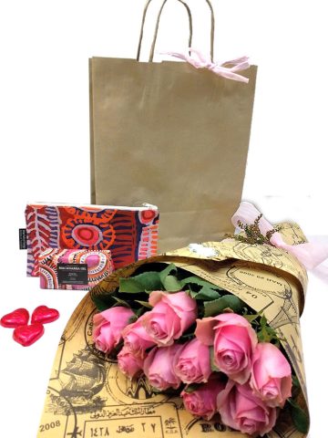 pink bouquet of roses with chocolates