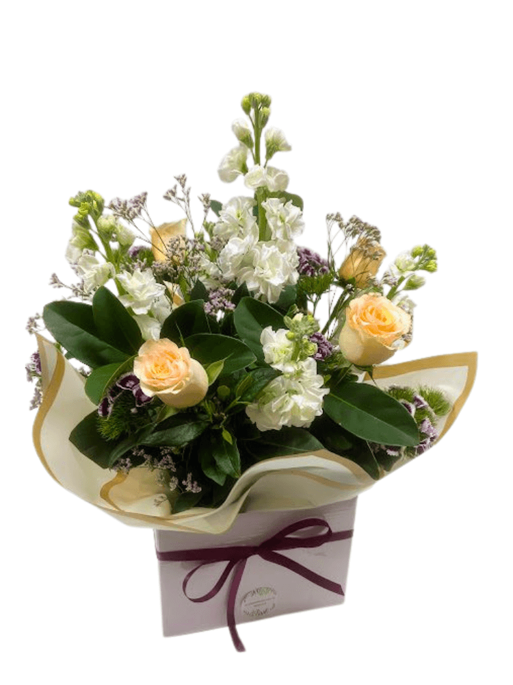 Pastel roses and pastel flowers in a box